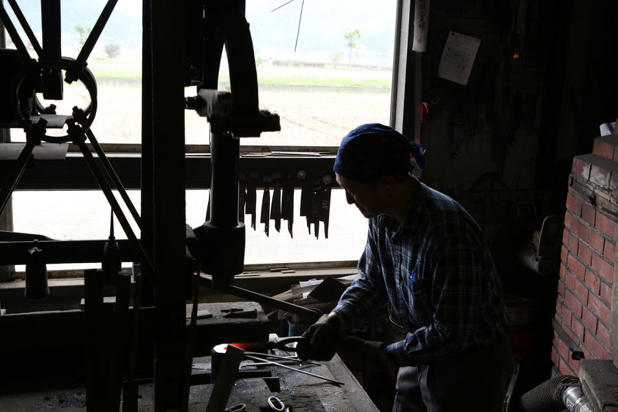 Shiro Kamo forging hot steel under the power hammer in his Takefu Knife Village forge, October 2015